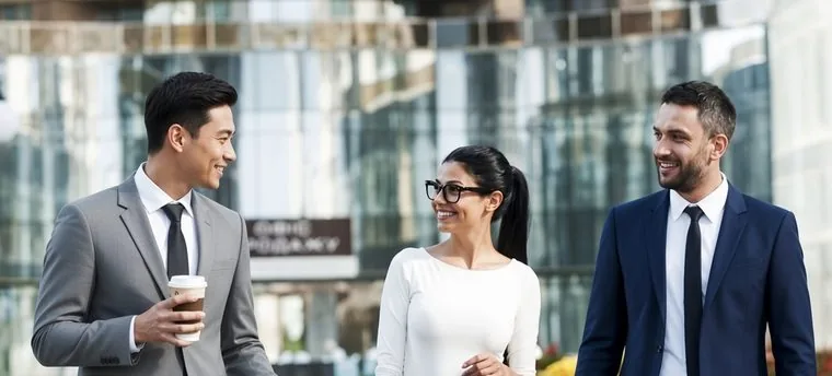 Business professionals in conversation outside an office